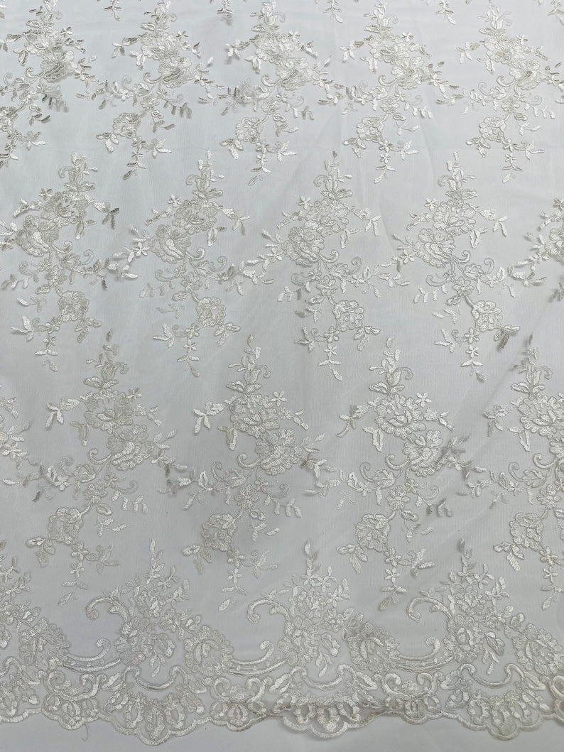 Corded embroider flowers on a mesh lace fabric-prom-sold by the yard.