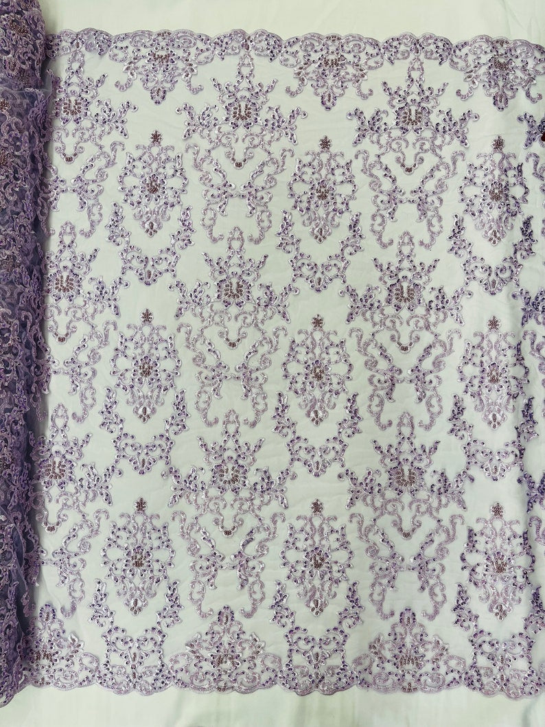 Damask embroider with sequins and heavy beaded on a mesh lace fabric-sold by the yard