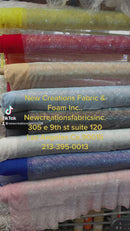 AB Rhinestones on a fish net fabric | New Creation Fabric & Foam Inc.