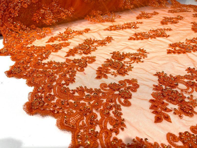 Orange elegant hand beaded flower design embroider on a mesh lace-prom-sold by the yard.