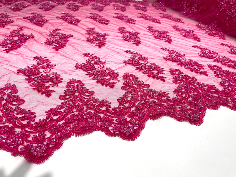 Fuchsia elegant hand beaded flower design embroider on a mesh lace-prom-sold by the yard.