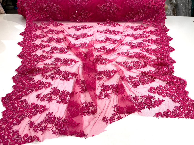 Fuchsia elegant hand beaded flower design embroider on a mesh lace-prom-sold by the yard.