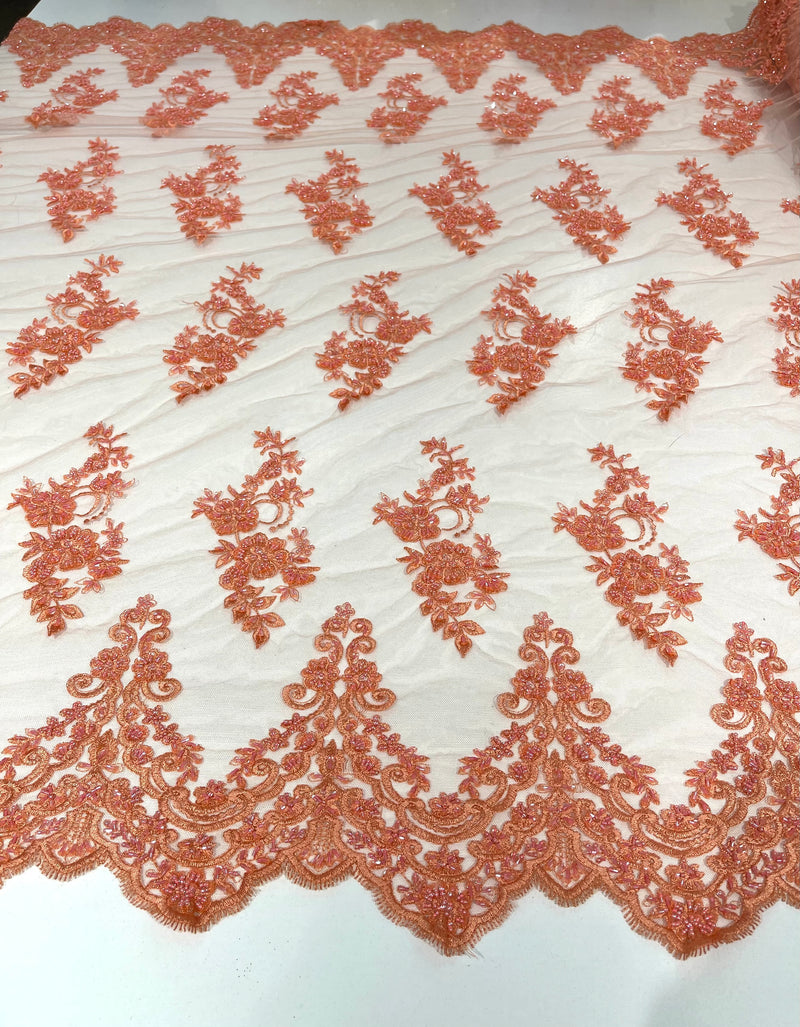 Coral elegant hand beaded flower design embroider on a mesh lace-prom-sold by the yard.