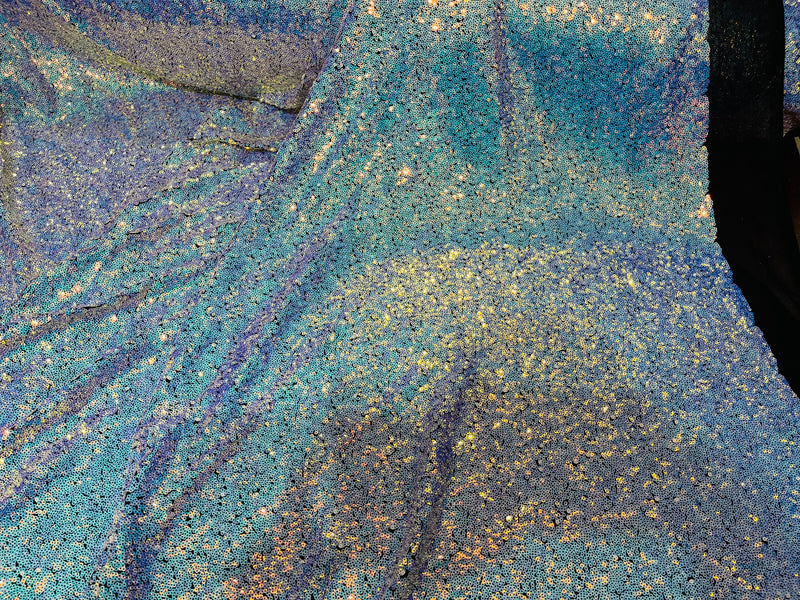 Aqua Iridescent Mini Glitz Sequins on a Black 4 Way Stretch Mesh-Sold By The Yard.