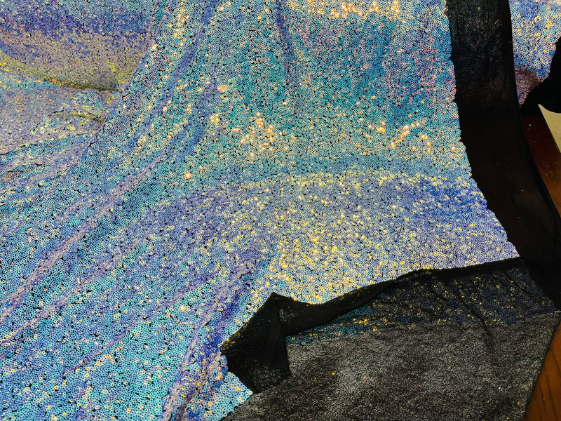 Aqua Iridescent Mini Glitz Sequins on a Black 4 Way Stretch Mesh-Sold By The Yard.