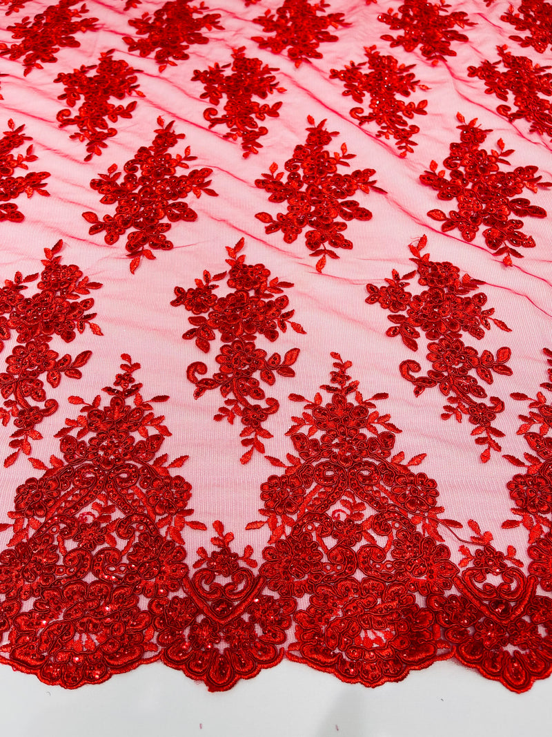 Red floral design embroidery on a mesh lace with sequins and cord-sold by the yard.