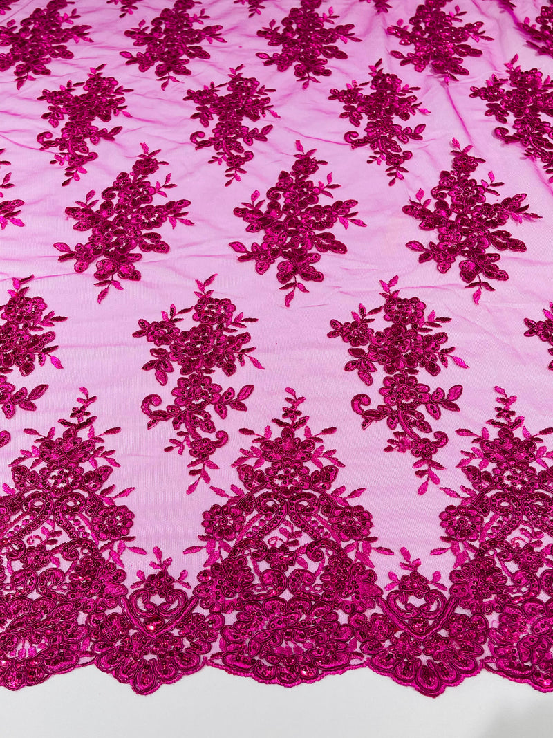 Fuchsia floral design embroidery on a mesh lace with sequins and cord-sold by the yard.