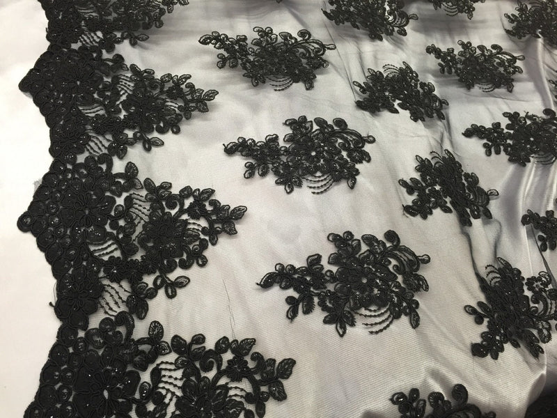 Black flower lace corded and embroider with sequins on a mesh. Wedding/bridal/prom/nightgown fabric. Sold by the yard.