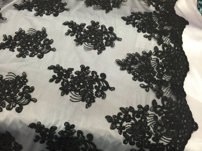 Black flower lace corded and embroider with sequins on a mesh. Wedding/bridal/prom/nightgown fabric. Sold by the yard.