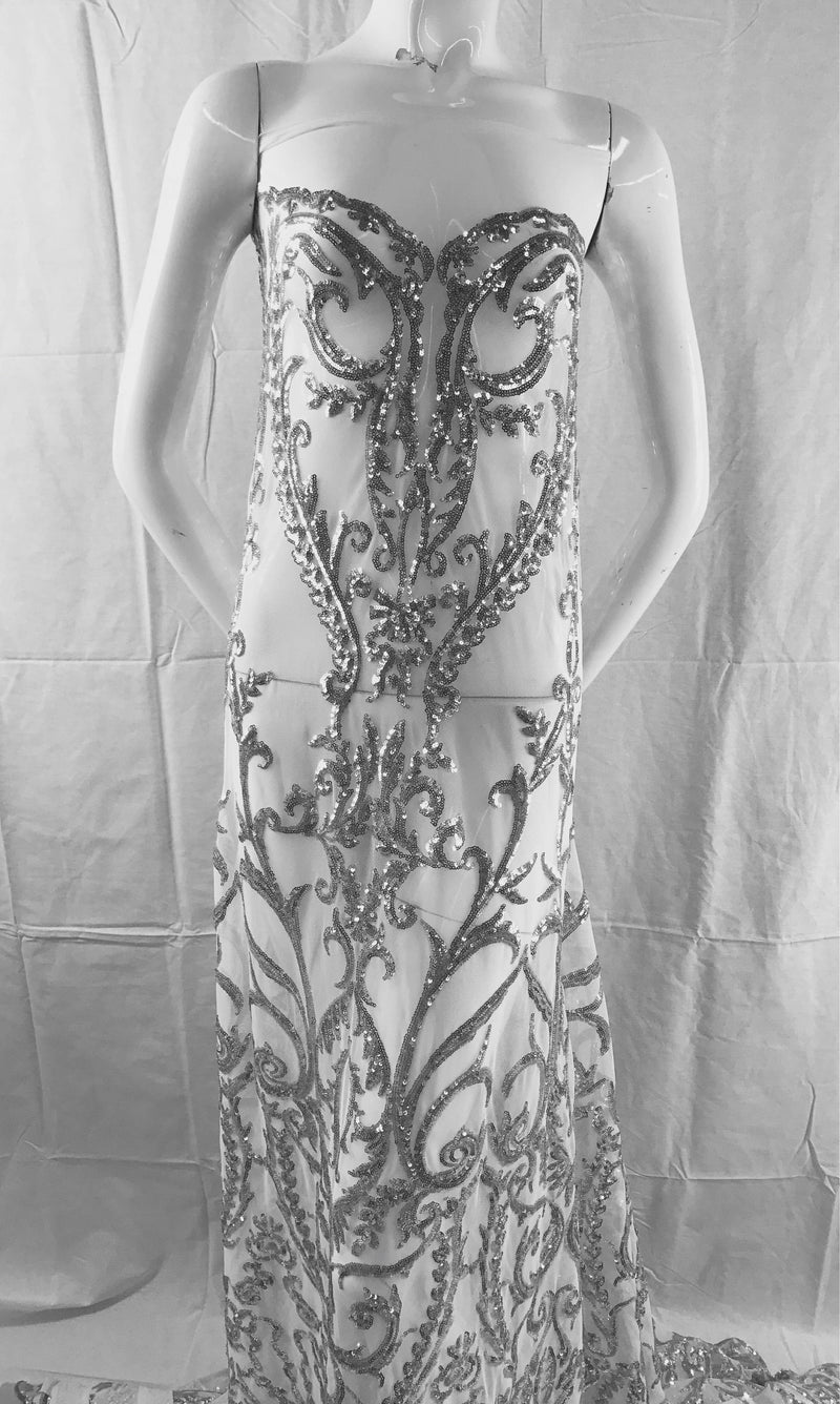 Silver damask design embroider with Sequins on a 2 way stretch white mesh-fashion-dresses-yards gowns-decorations-sold by the yard.