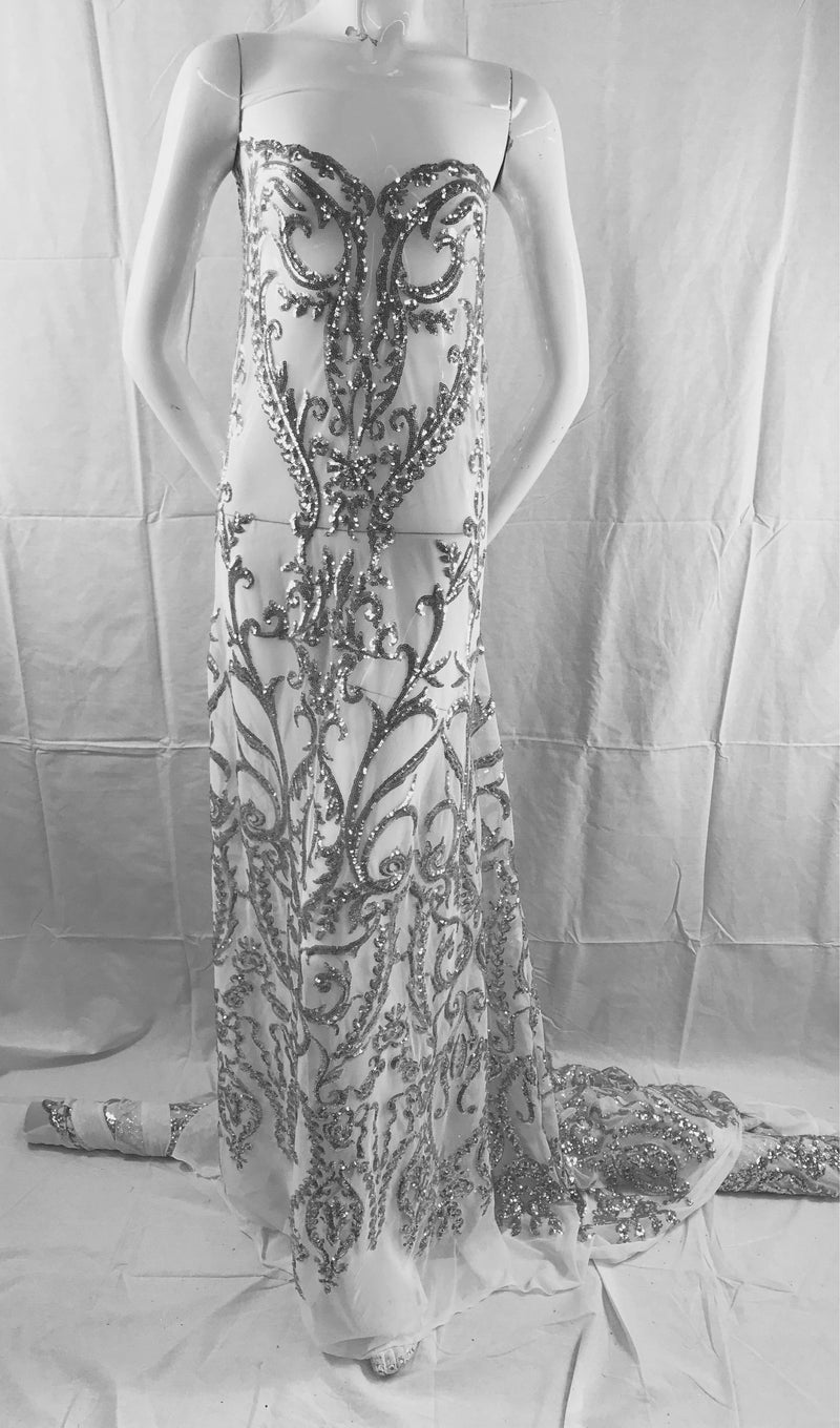 Silver damask design embroider with Sequins on a 2 way stretch white mesh-fashion-dresses-yards gowns-decorations-sold by the yard.