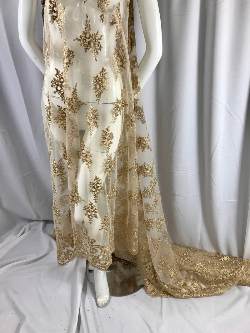 Gold paisley flower embroider and corded with a metallic gold tread on a mesh lace-wedding-bridal-prom-nightgown-decorations- sold by yard.