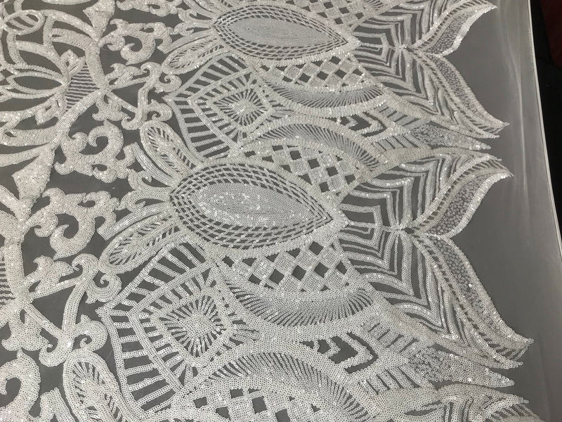 White royalty design embroider with shiny sequins on a 4 way stretch mesh-sold by the yard.