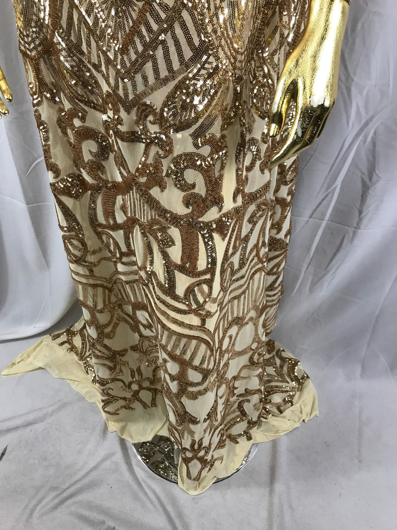 Gold royalty design embroider with shiny sequins on a 4 way stretch power mesh-sold by the yard.