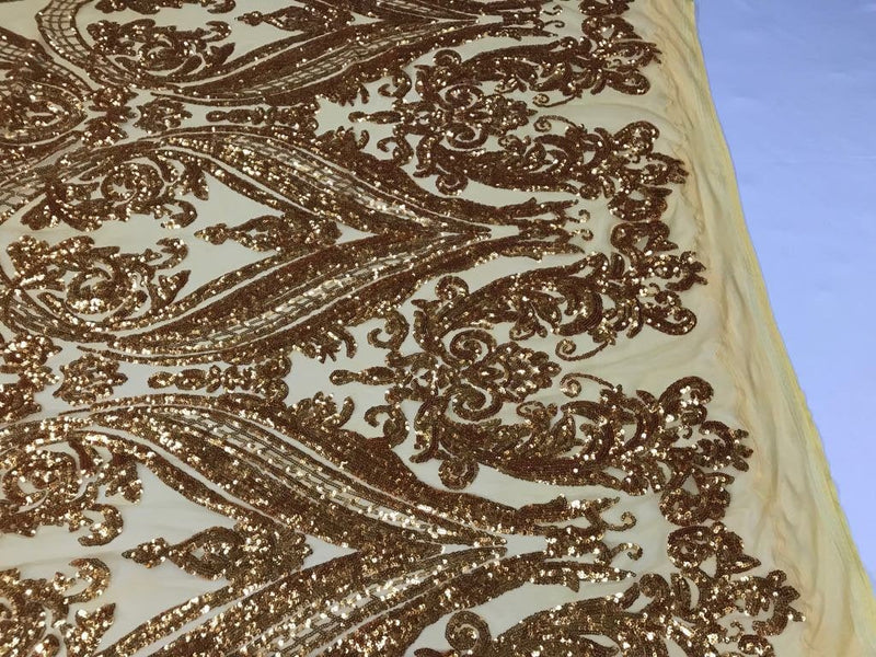 Gold empire design embroider with shiny sequins on a 4 wY stretch power mesh-dresses-fashion-apparel-prom-nightgown-sold by yard.