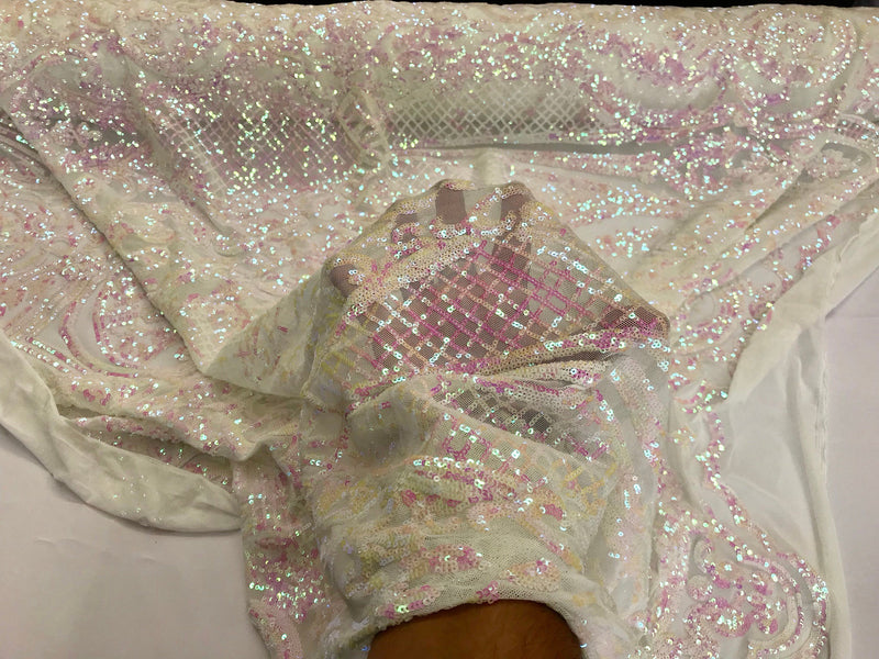 Pink princess design iridescent sequins on a 4 way stretch white mesh-sold by the yard.