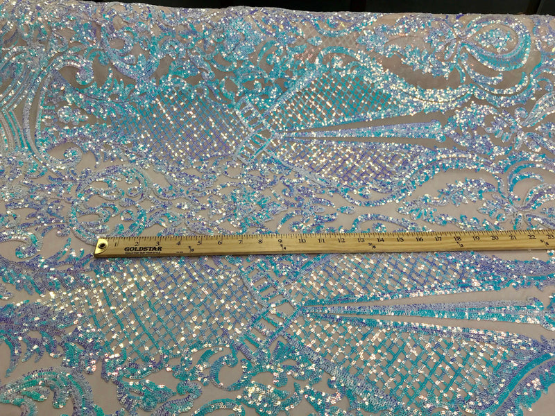 Aqua princess design iridescent sequins embroidery on a 4 way stretch nude mesh-sold by the yard.