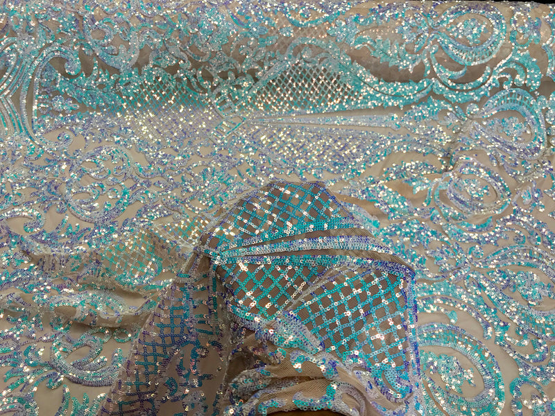 Aqua princess design iridescent sequins embroidery on a 4 way stretch nude mesh-sold by the yard.