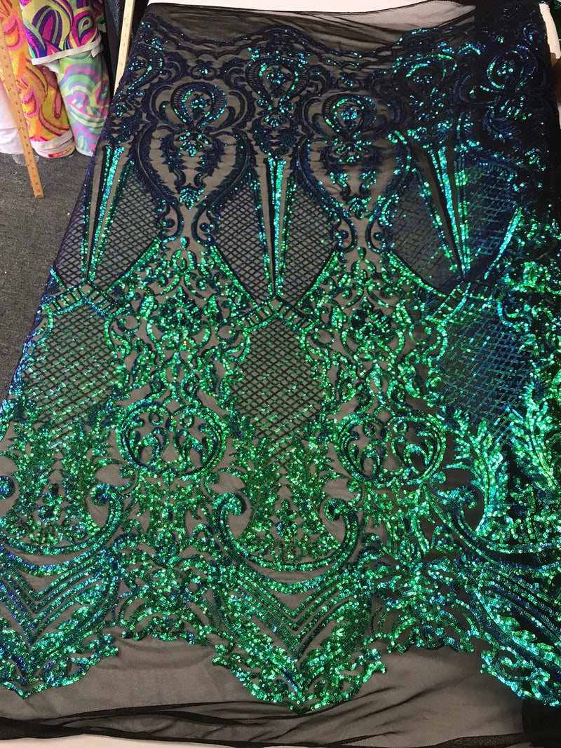 Green princess design iridescent sequins embroidery on a 4 way stretch black mesh-dresses-apparel-prom-nightgown-fashion-sold by the yard.