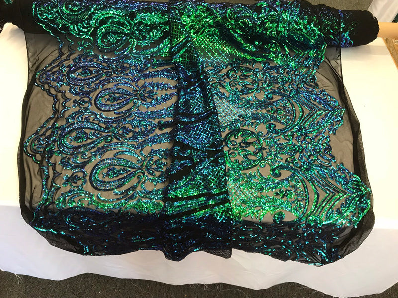 Green princess design iridescent sequins embroidery on a 4 way stretch black mesh-dresses-apparel-prom-nightgown-fashion-sold by the yard.