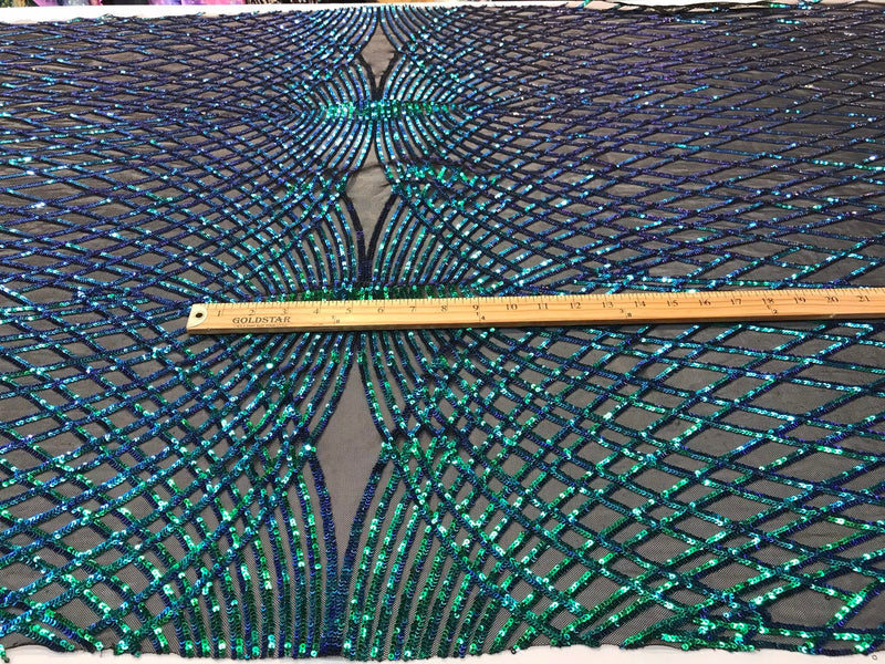 Iridescent green sequin diamond design embroidery on a black 4 way stretch mesh-sold by yard.