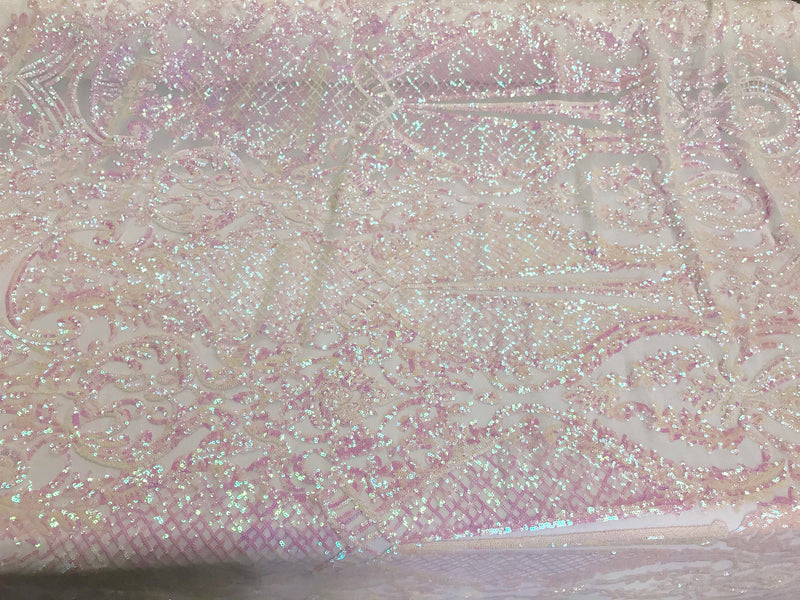 Pink princess design iridescent sequins on a 4 way stretch white mesh-sold by the yard.