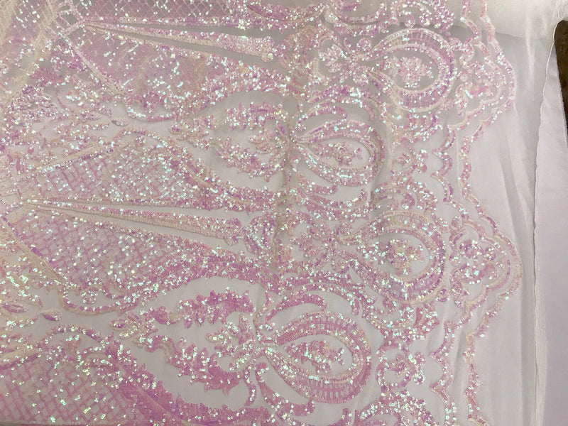 Pink princess design iridescent sequins on a 4 way stretch white mesh-sold by the yard.