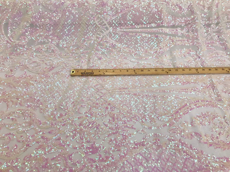 Pink princess design iridescent sequins on a 4 way stretch white mesh-sold by the yard.