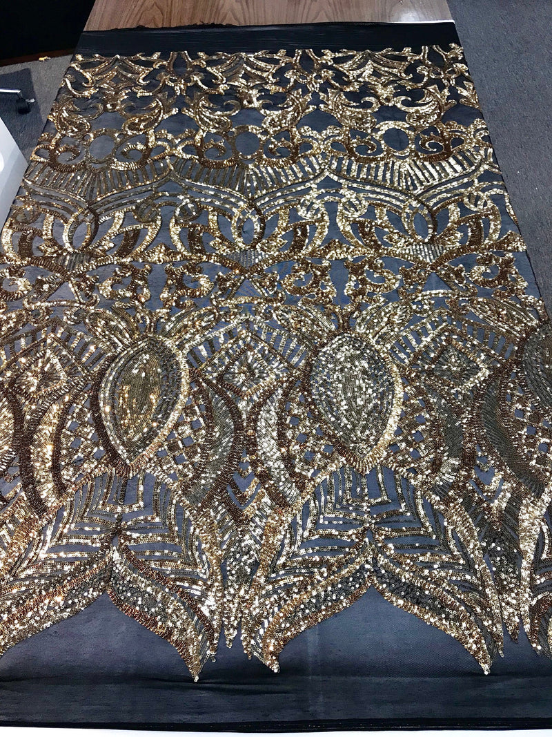 Gold royalty design embroidery sequins on a black 4 way Stretch Mesh -dresses-fashion-apparel-prom-nightgown-sold by the yard.