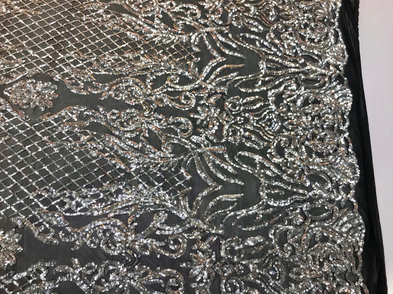 Silver shiny sequin damask design embroidery on a 4 way stretch black mesh-sold by yard.