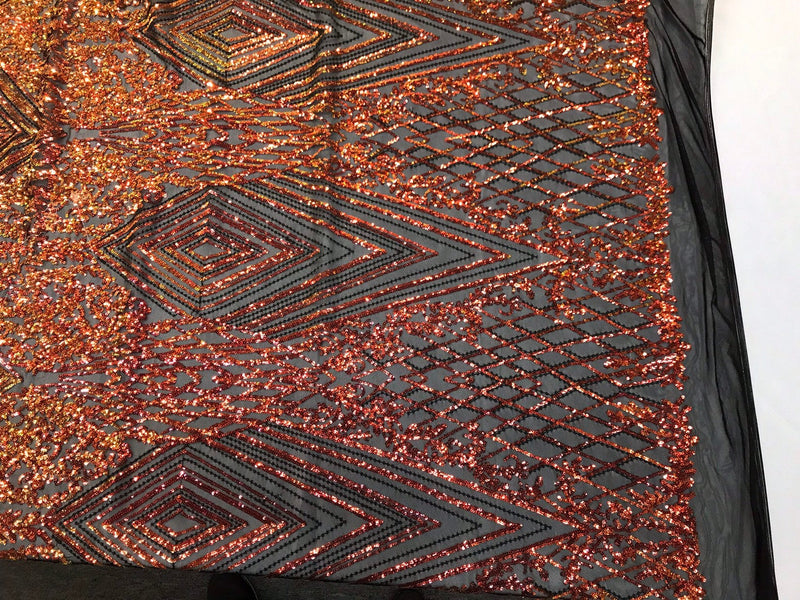 Orange geometric diamond design with shiny iridescent sequins on a black 4 way stretch mesh-dresses-prom-nightgown-sold by the yard-