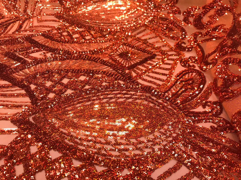 Burnt orange iridescent shiny sequin royalty design on a 4 way stretch mesh-sold by the yard.