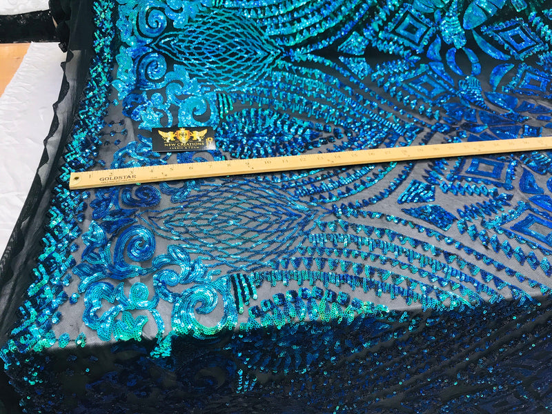 New green/blue iridescent diamond design with sequin on a black 4 way stretch mesh-sold by the yard