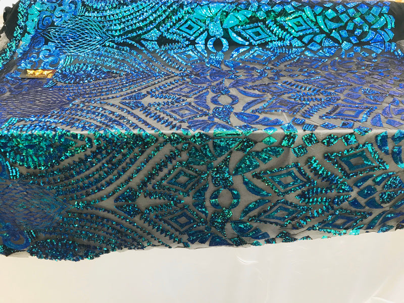 New green/blue iridescent diamond design with sequin on a black 4 way stretch mesh-sold by the yard