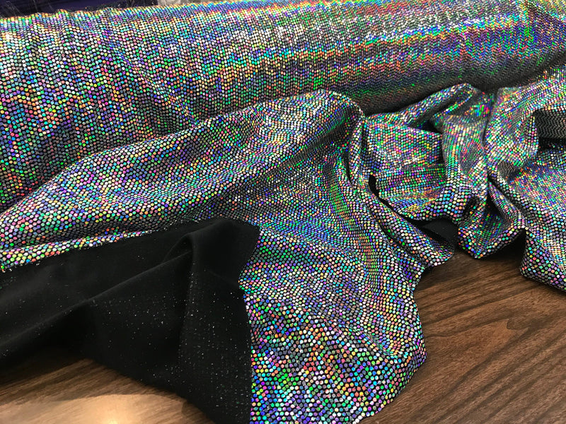 silver iridescent hologram round sequins on a metallic black spandex-sold by the yard-free shipping in the usa.