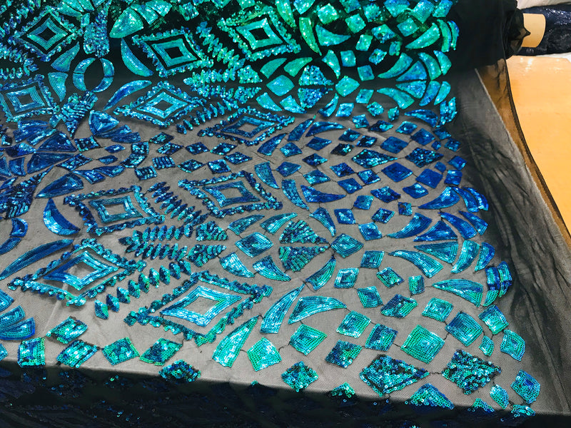 New green/blue iridescent diamond design with sequin on a black 4 way stretch mesh-sold by the yard