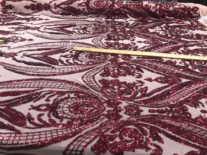 Burgundy big damask sequin design on a nude 4 way stretch mesh-sold by the yard.