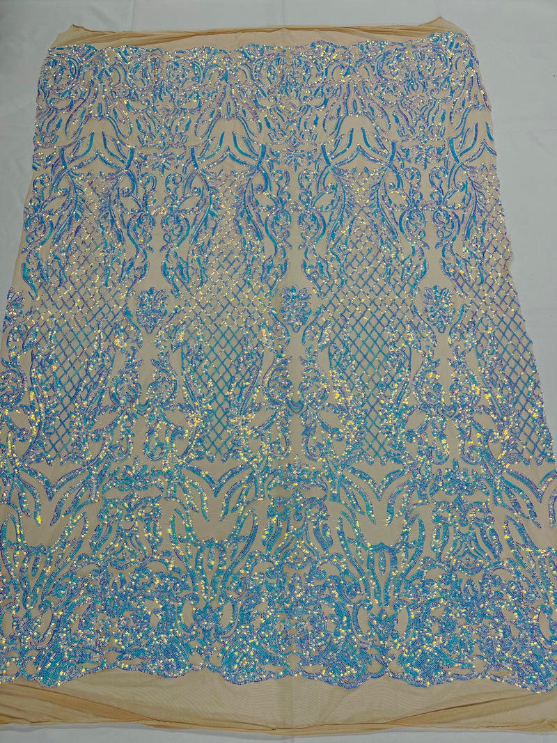 Aqua iridescent shiny sequin damask design on a nude 4 way stretch mesh-prom-sold by the yard.