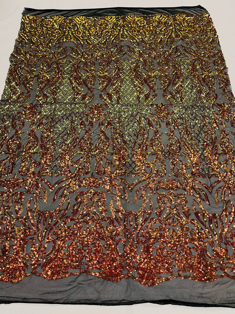 Orange iridescent shiny sequin damask design on a black 4 way stretch mesh-prom-sold by the yard.