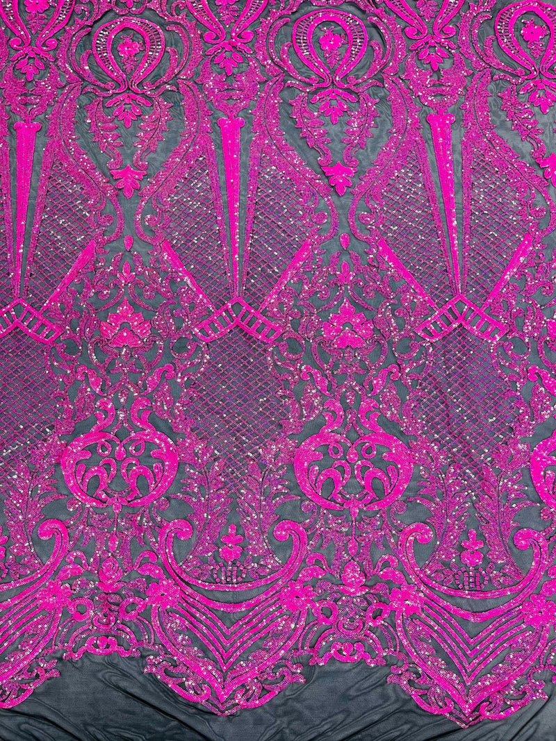 Hot pink princess design iridescent sequins on a 4 way stretch black mesh-sold by the yard.