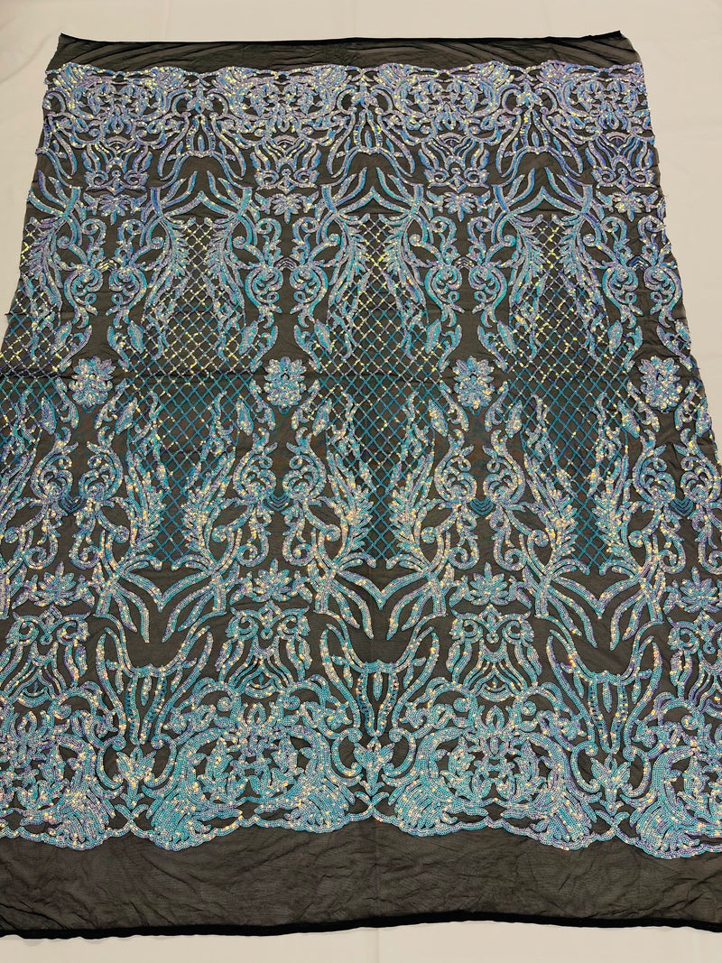 Aqua blue iridescent shiny sequin damask design on a black 4 way stretch mesh-sold by the yard.