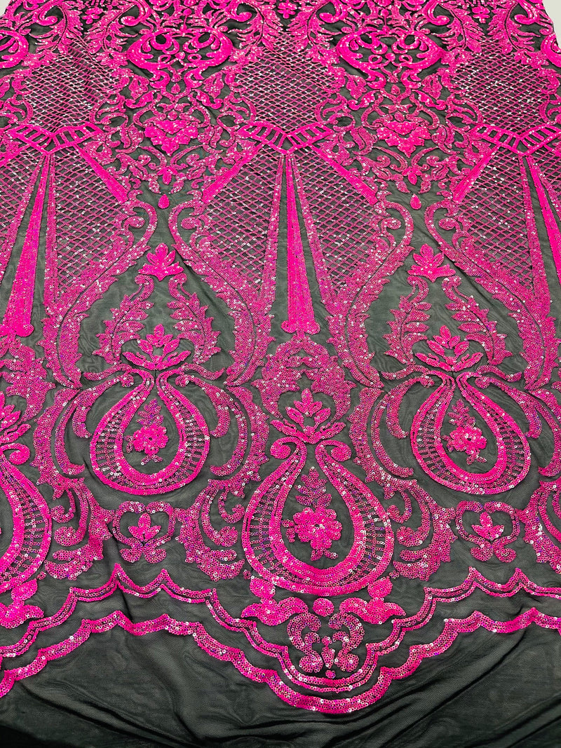 Hot pink princess design iridescent sequins on a 4 way stretch black mesh-sold by the yard.