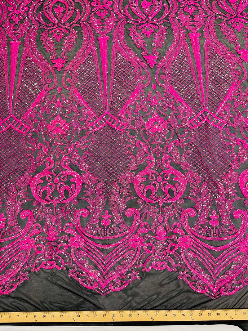 Hot pink princess design iridescent sequins on a 4 way stretch black mesh-sold by the yard.