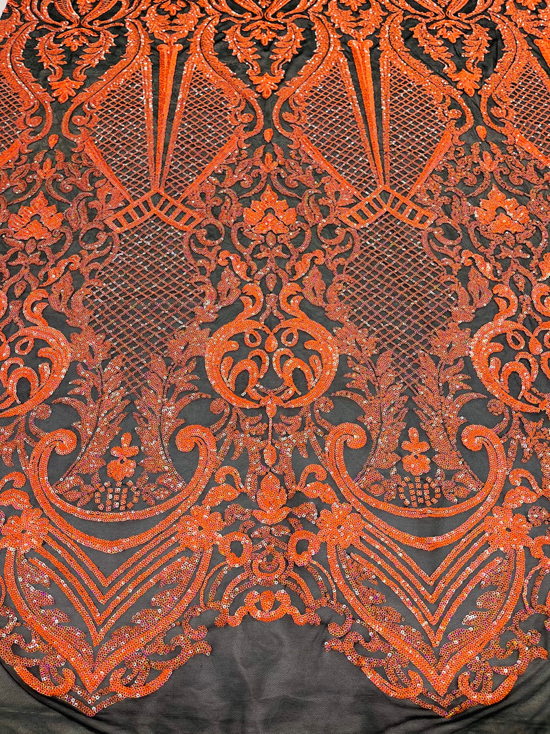 Neon orange princess design iridescent sequins on a 4 way stretch black mesh-sold by the yard.