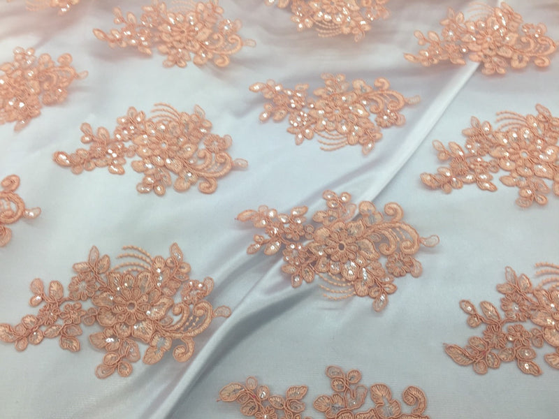 Peach flower lace corded and embroider with sequins on a mesh.wedding/bridal/prom/nightgown fabric. Sold by the yard.