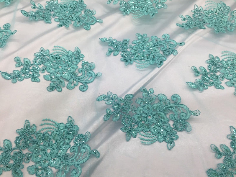 Aqua flower lace corded and embroider with sequins on a mesh. Wedding/bridal/prom/nightgown fabric. Sold by the yard.