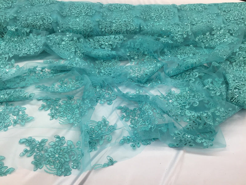 Aqua flower lace corded and embroider with sequins on a mesh. Wedding/bridal/prom/nightgown fabric. Sold by the yard.