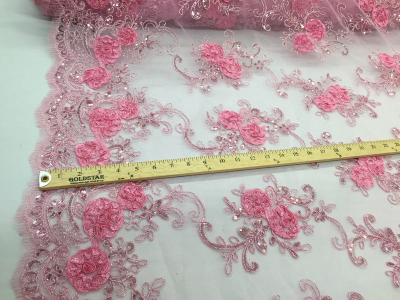 Pink 3d flowers embroider with sequins on a mesh lace fabric. Sold by the yard.