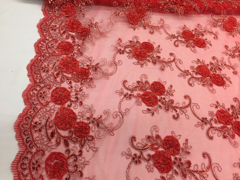 Red/silver  3d flowers embroider with sequins on a mesh lace fabric. Sold by the yard.