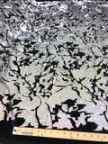 Camouflage flip sequin design on a black stretch velvet, Sold by the yard.